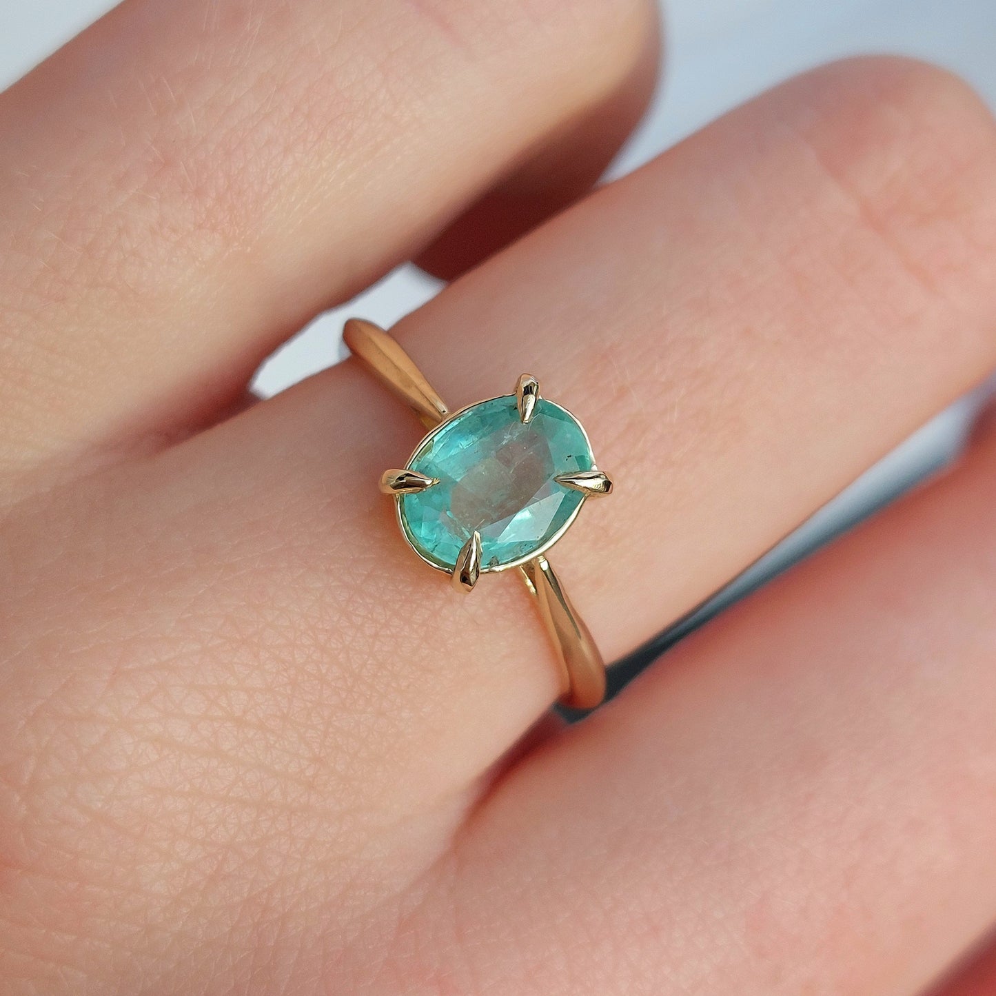 Verity - 8x6mm Colombian emerald set in 9ct yellow gold (Size O)