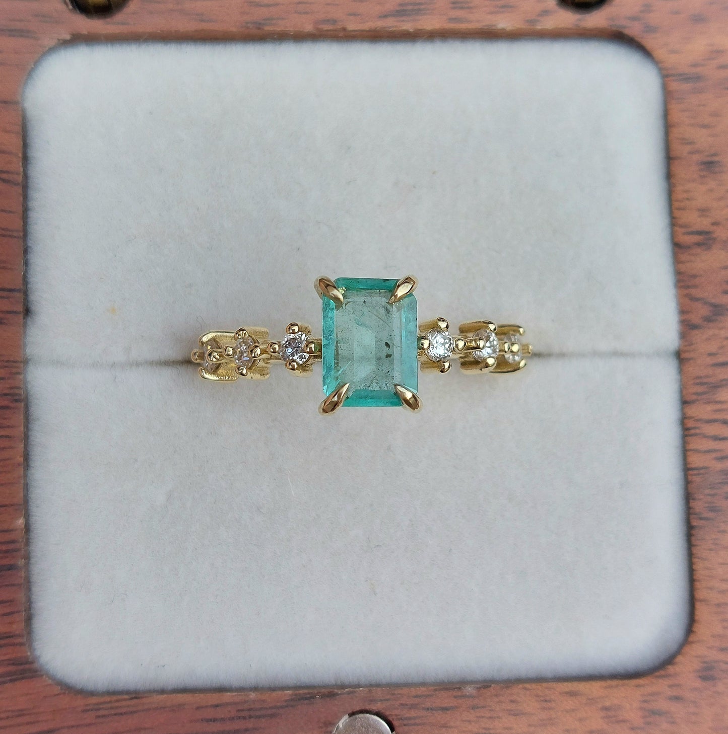 Esmerelda - 7x5mm Colombian emerald set in 9ct yellow gold (Size O)